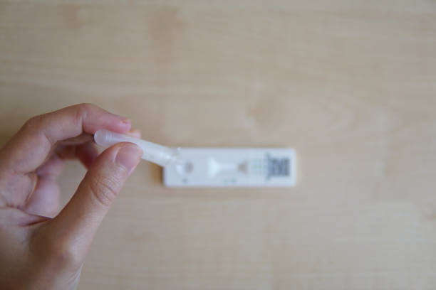 istock a woman doing the virus test. 1408001627