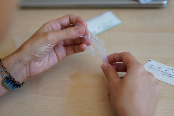 istock a girl preparing the virus test tube 1408001722