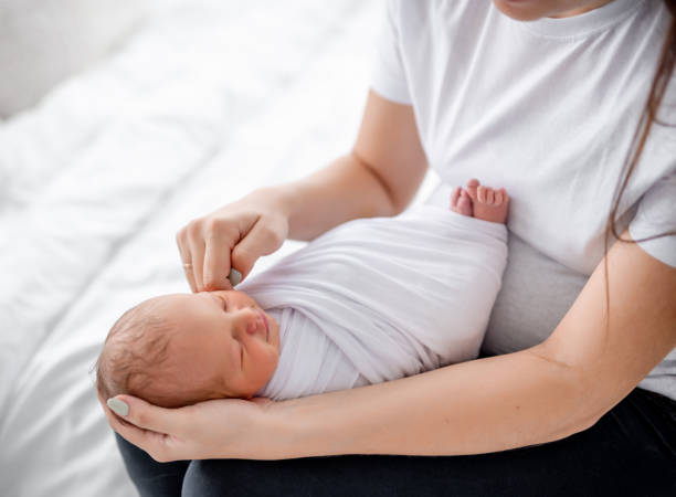 istock Mother with newborn baby 1408003737