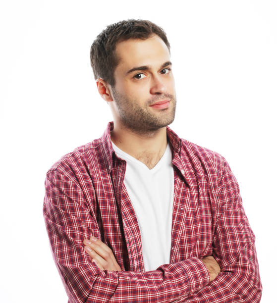 istock Handsome young man in shirt looking at camera 1408003888