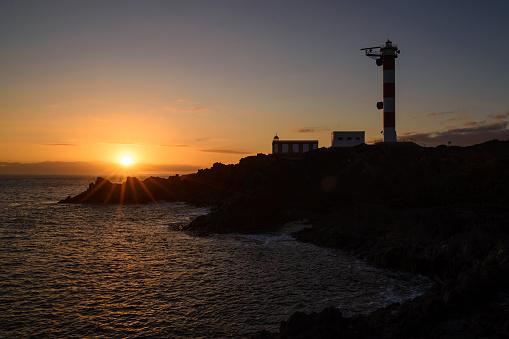 Sunset at Punta Rasca lighthouse, Tenerife, Canary Islands, Spain Keywords Language: Spanish