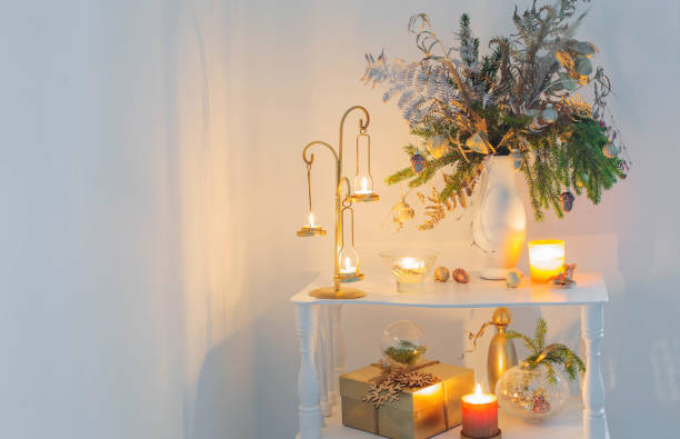 istock christmas decorations with burning candles  on white background at the evening 1408006108