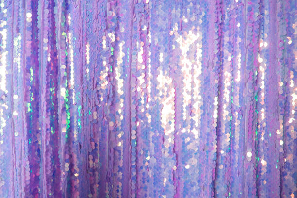 istock fabric of purple shiny sequins. textural background 1408006762