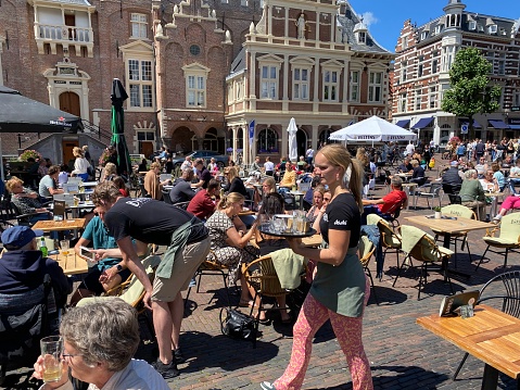 Copenhagen Denmark August 28th 2019 -  Outside Area with Chairs and Tables and pedestrians walking past