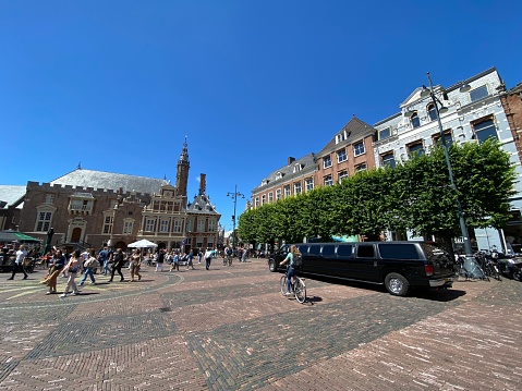 Haarlem, Netherlands, - June 28, 2022. Limousine parked on the square in the city center, waiting for the bride.
