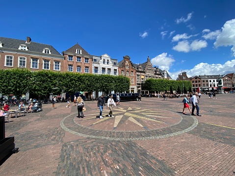 Haarlem, Netherlands, - June 28, 2022. People waking on the square  in the city center of Haarlem.