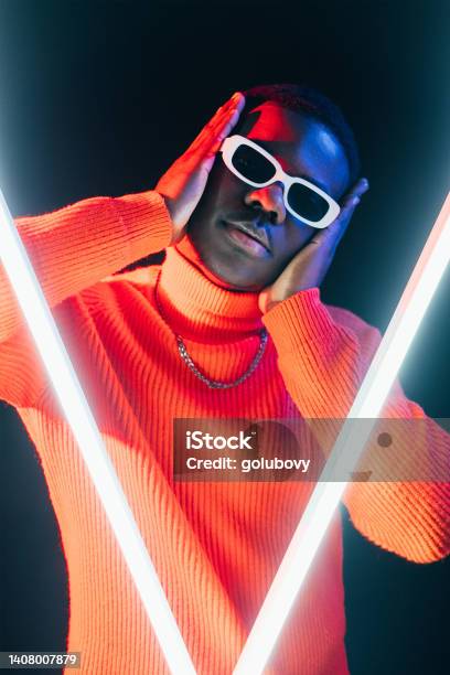 Modern Fashion Vogue Dance Neon Light Cool Man Stock Photo - Download Image Now - Haute Couture, Dancing, Neon Lighting