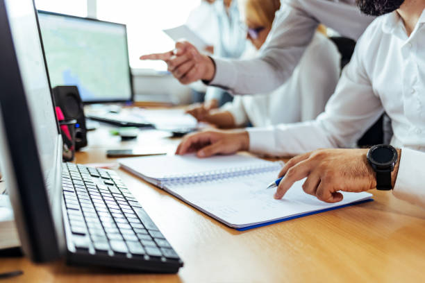 istock Businessman checking agreement before signing while sitting on his desk during the day. 1408008204