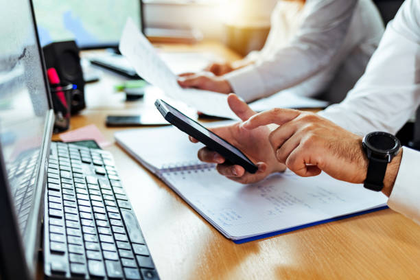 istock Businessman holding smart phone 1408008247