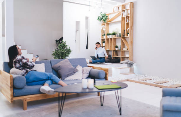 istock Female friends resting in light modern apartment 1408009136