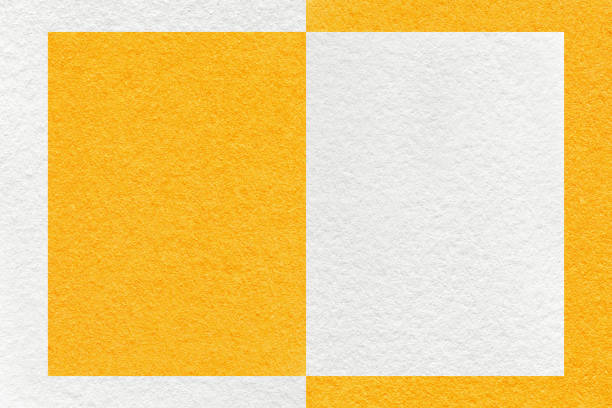 istock Texture of white and bright yellow paper background with geometric shape and pattern, macro. Craft orange cardboard 1408014812
