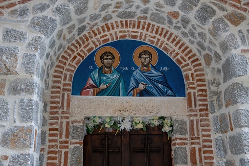 Ohrid, Macedonia - 07 09 2022: entrance to the monastery Saint Kuzman and Damian with icons of the saints near Ohrid in Nort Macedonia