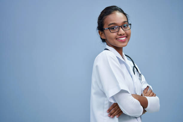 istock confident hijab doctor with lab coat against gray background 1408017088