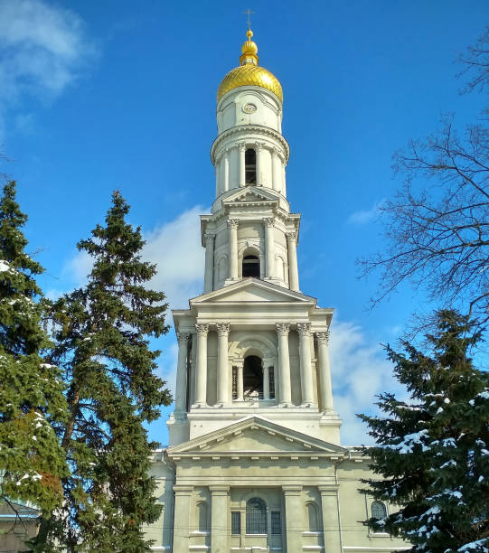 Cathedral in Kharkiv city. Christian Church. White tall building. Bell tower against the blue sky stock photo
