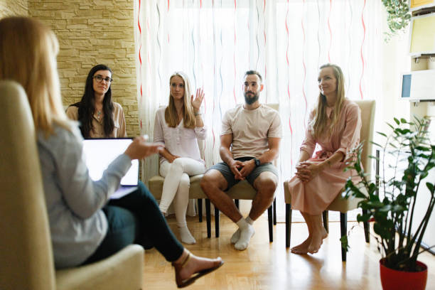 istock Group of people on a meeting with professional therapist 1408017623