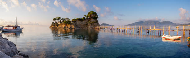 The first light of day falls on the small island of Agios Sostis, on the eastern side of the Greek island of Zakynthos.