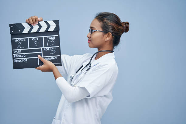 young doctor with clapper board work life balance