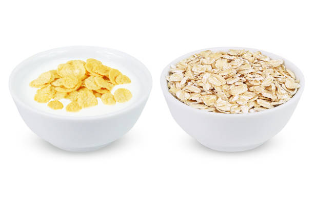 istock Corn flakes and oatmeal on an isolated white background. 1408019046