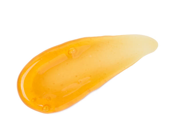 istock Clear orange gel smear smudge with bubbles macro isolated 1408019516