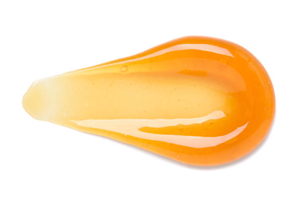 istock Orange gel smear with bubbles isolated on white 1408019564