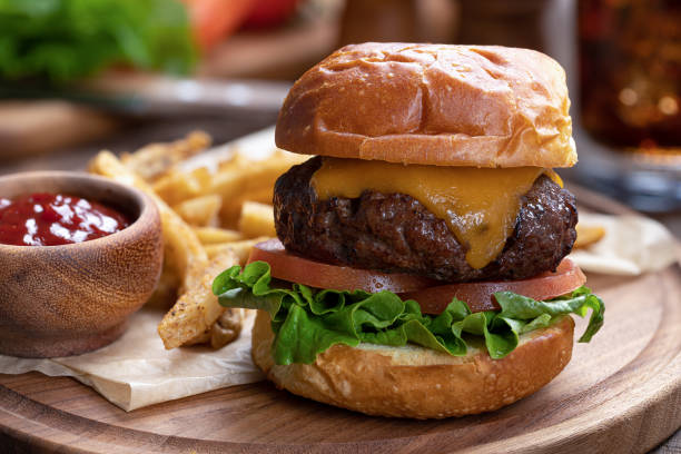 istock Cheeseburger with lettuce and tomato on toasted bun 1408020567
