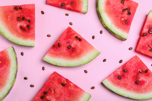 istock Delicious ripe watermelon on pink background, flat lay 1408020619