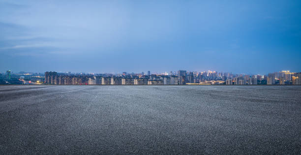istock Asphalt road and city skyline at night 1408021070