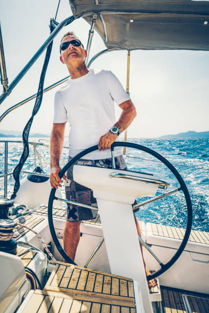 istock Skipper sailing on sailboat 1408022694
