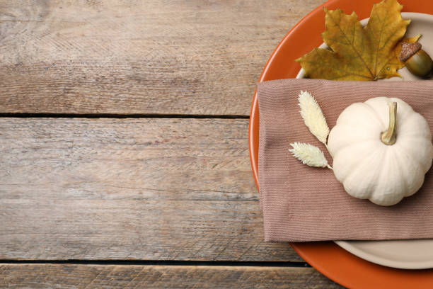 istock Festive table setting with autumn decor on wooden background, top view. Space for text 1408022707