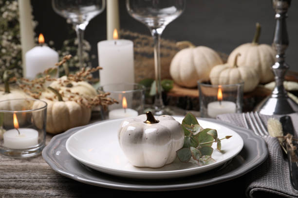 istock Beautiful autumn place setting and decor on wooden table 1408022744