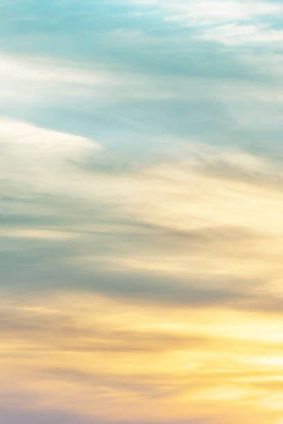 istock Vertical ratio size of sunset background. sky with soft and blur pastel colored clouds. gradient cloud on the beach resort. nature. sunrise.  peaceful morning. Instagram toned style 1408023216