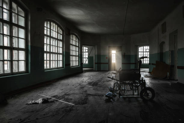 Inside old Orlovka Asylum for the insane in Voronezh Region. Dark creepy abandoned mental hospital Inside old Orlovka Asylum for the insane in Voronezh Region. Dark creepy abandoned mental hospital. old abandoned hospital room stock pictures, royalty-free photos & images