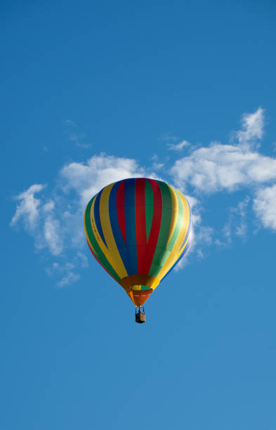 istock Hot Air Balloon against Blue Sky 1408025440