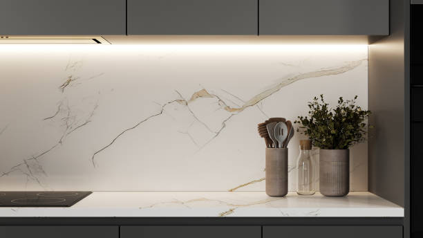 istock Kitchen cabinets in dark gray color, modern kitchen interior with marble, 3d render 1408026416