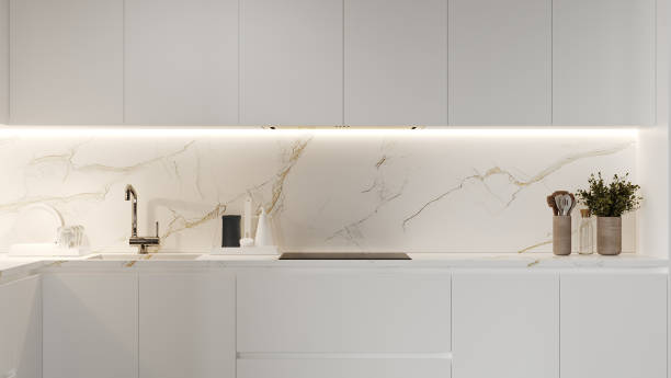 istock Kitchen cabinets in white color, modern kitchen interior with marble, 3d render 1408026427