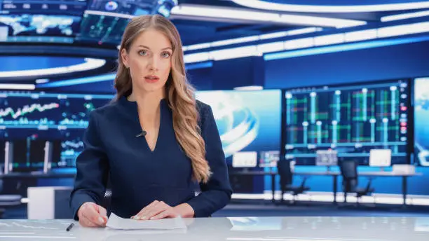 Photo of TV Live News Program: Professional Female Presenter Reporting on Current Events. Television Cable Channel Anchorwoman Talks Confidently. Mock-up Network Broadcasting in Newsroom Studio.