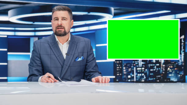 istock TV Talk Show Live News Program: Anchorman Presenter Reporting, Uses Green Screen Template. Television Cable Channel Anchorman Host Talks. Network Broadcast Newsroom Studio Mockup. 1408027384