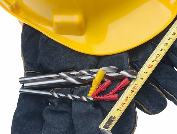 istock hard hat with drills and tape measure 140802903
