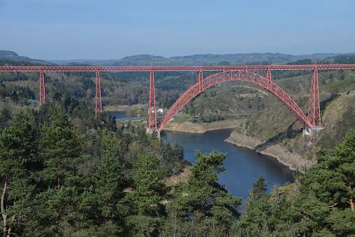 The Garabit Viaduct is a railway arch bridge spanning the river Truyère in the mountainous Massif Central region. It was designed by Gustave Eiffel