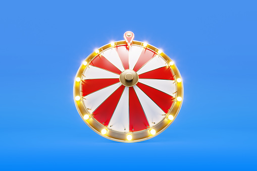 Wheel of fortune on blue background. Horizontal composition with copy space. Low angle view.