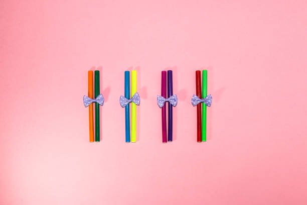 istock pairs of felt-tip pens with a bow on a pink background, creative modern design, back to school, pairs in the bench, trendy colors 1408029652