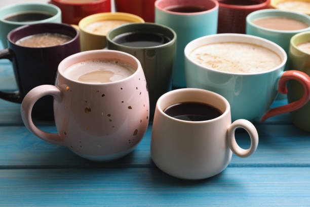 istock Many cups of different coffee drinks on light blue wooden table 1408029665