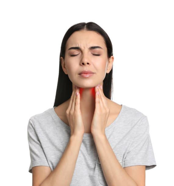 istock Young woman doing thyroid self examination on white background 1408032442