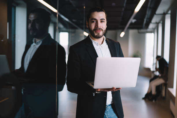 istock Businessman using laptop at office 1408033719