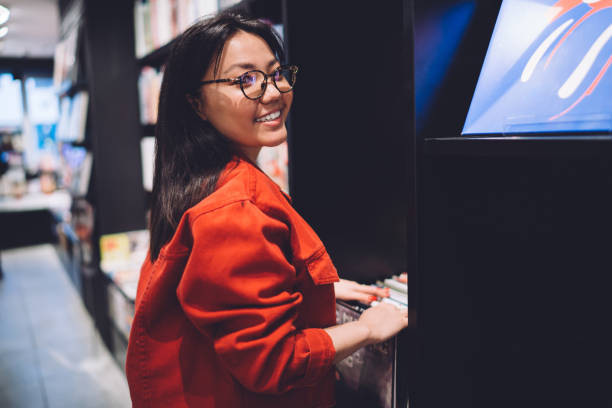 istock Smiling lady choosing purchases from rack 1408033769