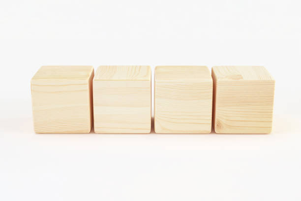 istock four wooden cube block in row isolated on white background, blank sample template for design. 3d render 1408033864