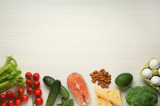 istock Flat lay composition with fresh organic products on white wooden table, space for text. Keto diet 1408034109