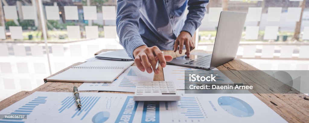 The financiers are calculating personal taxes for their customers. Finance Stock Photo
