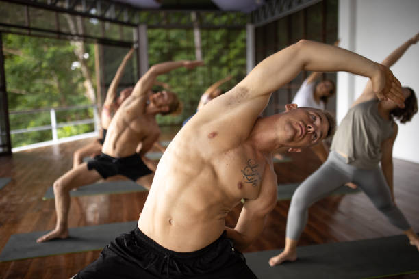 istock Multiracial people practise yoga, during group yoga class 1408037206