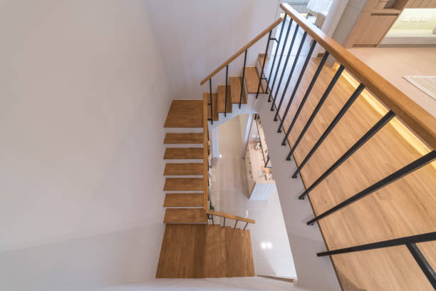 istock wooden modern stairs and railing 1408039028